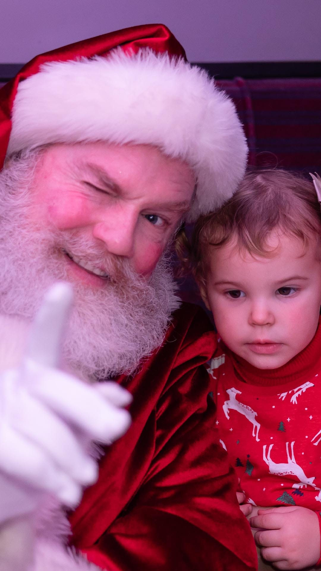 santa and child on board the polar express train ride